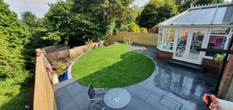 Steel black porcelain patio and artificial grass | Pro Gardens