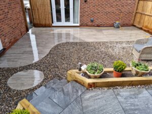 Patio with Curved Pebble Trim | Pro Gardens